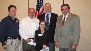 Elvis Moreland, chapter Professional Development Center chair, joins Albert Soud, department chair, DeVry University, and Dena Sandy, employer liaison, DeVry University, at the May luncheon.
